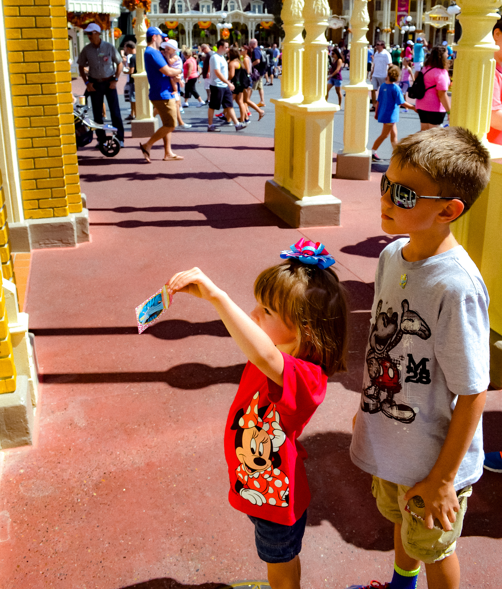 A boy and girl playing Sorcerer's of the Magic Kingdom, a sensory-friendly attraction. 