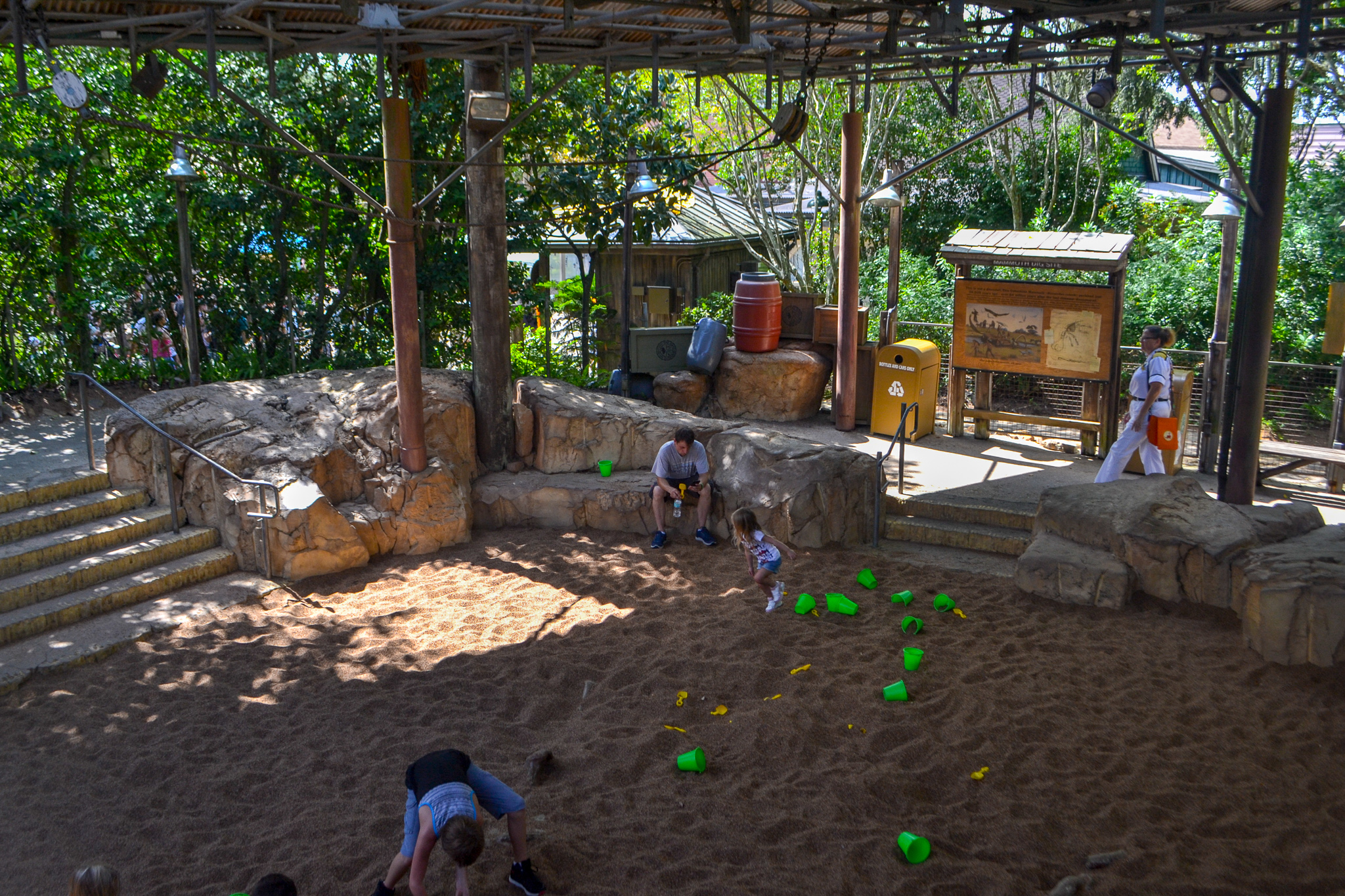 Children digging in sand pit at Boneyard in Animal Kingdom