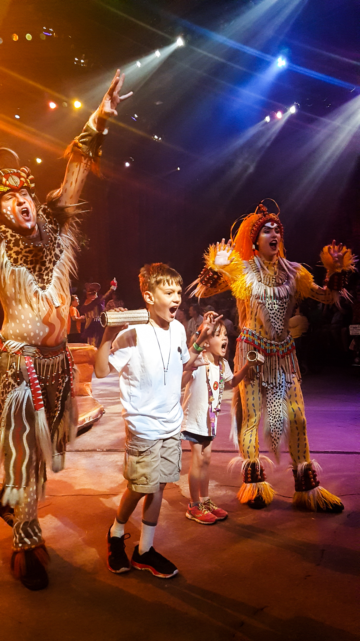 Children interacting with cast during audience interactive song in Festival of Lion King in Animal Kingdom